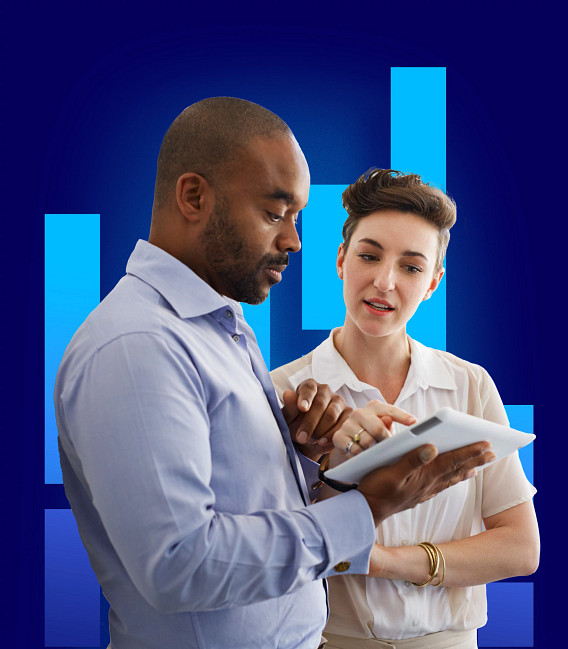 Two colleagues looking at a tablet.